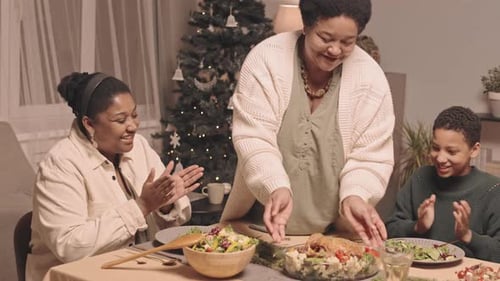 Family Enjoys Christmas Dinner Celebration Together