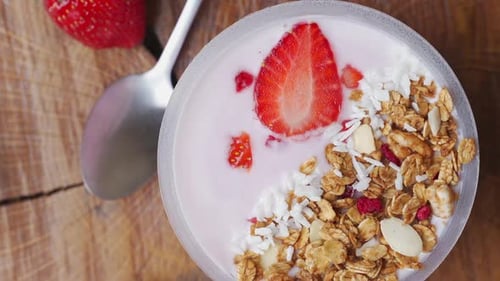 Rotating Breakfast with Yogurt, Granola, with Superfood Toppings, the View From the Top. Concept of