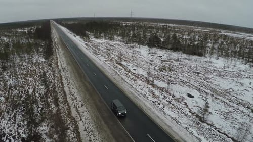 Car Driving on Rural Highway in Winter