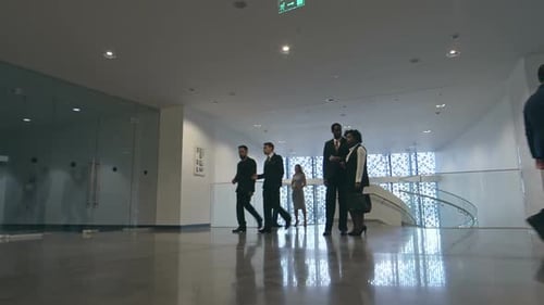 Businesspeople in Lobby of Modern Business center