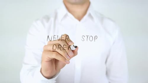 Man Writes Never Stop Dreaming with Pen