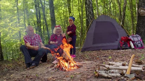 Grandparents and Child Camping in a Forest