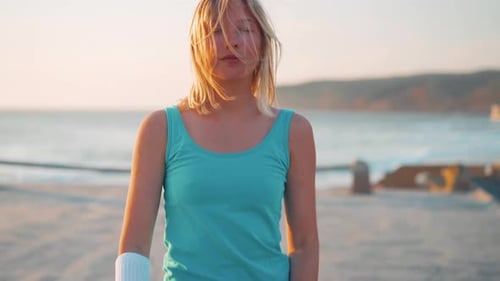 Blonde Woman Posing on Beach at Sunset
