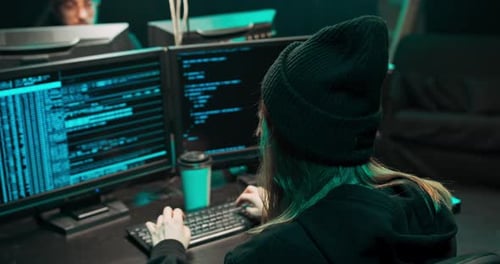 Woman Hacking System With Computer and Code
