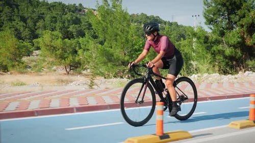 Young woman riding bicycle