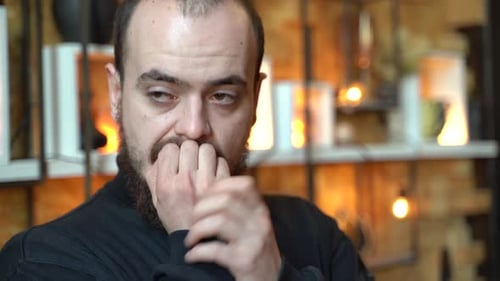 Man with Beard in Contemplation Close Up