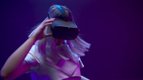 Woman Wearing VR Headset Moving Hands Around