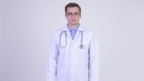 Smiling Young Doctor in White Coat and Stethoscope