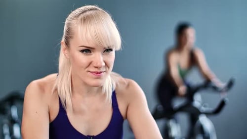 Closeup Face of Laughing Beautiful Woman at Cycling Class