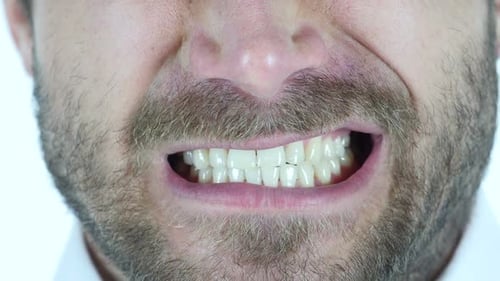 Angry Man grinding Teeth