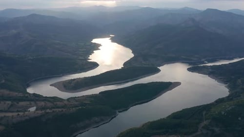Flying Over Dam at Sunset