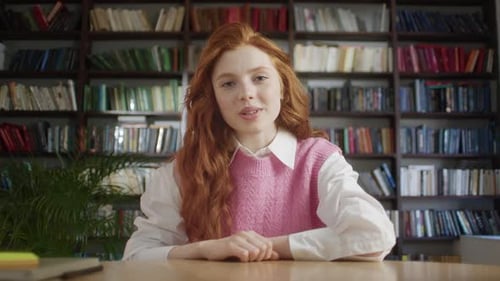 Young Woman Talking to Camera in Library Setting