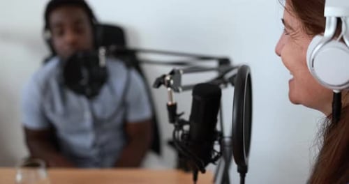 Hosts having podcast session together - Female speaker making an interview during live stream