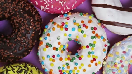 Colorful Donuts with Icing and Sprinkles