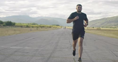 Close Up View of Jogger During Intense Training in the Morning