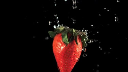 Strawberry Splashed With Water in Slow Motion