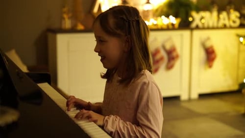 Girl Plays Piano at Christmastime, Holidays at Home