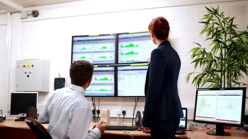 Data Center Colleagues Talking in Office