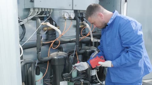 The technician repair electronic temperature sensors with an electronic