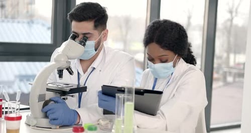 Scientists Working in Modern Laboratory Setting