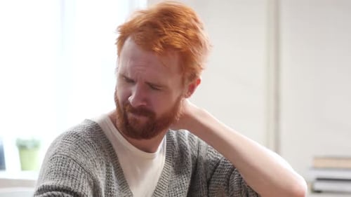 Adult Man Massaging Neck Due to Pain