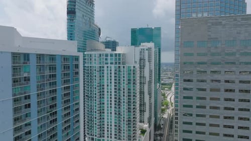 Fly Around Tops of Modern High Rise Buildings in Urban Borough