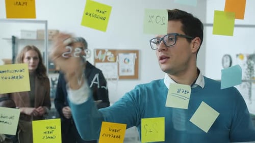 Business Team Planning and Strategizing in Modern Office