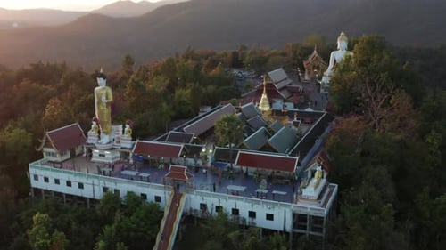 Aerial View of Wat Phrathat Doi Kham Buddha Pagoda and Golden Chedi in Chiang Mai Thailand