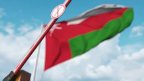 Oman Flag and Closing Barrier with No Coronavirus Sign