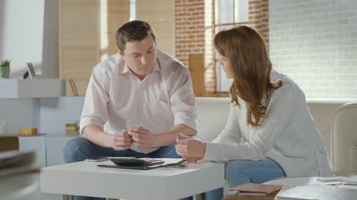 Couple Calculating Income and Expenses, Low Family Budget, Money