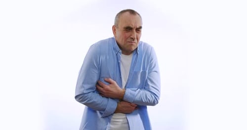 Man Clutching Stomach in Painful Abdominal Cramp