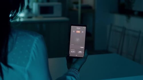Woman Controls Smart Home With Mobile Phone App