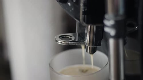 Close Up Coffee Machine Dispensing Espresso