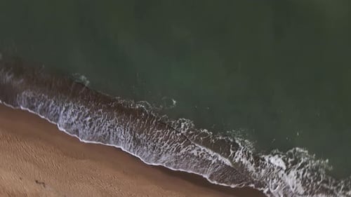 Aerial view of sandy beach and sea with waves, Top view, amazing nature background