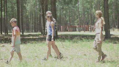 Family walking through woods