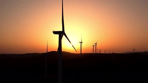 Wind Turbines Silhouetted at Colorful Sunset