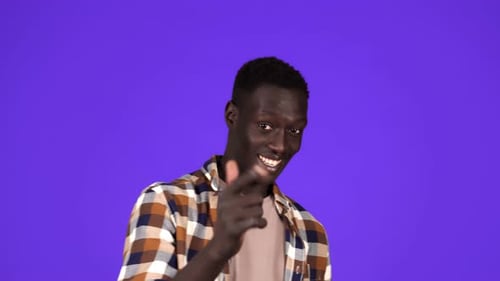 Smiling Man Gestures Call Me Hand Sign