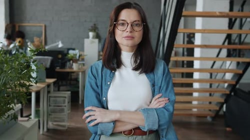 Slow Motion Portrait of Attractive Young Businesswoman Standing in Coworking Office