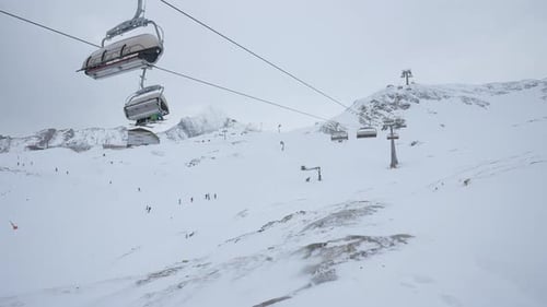 Chairlifts riding at a ski resort