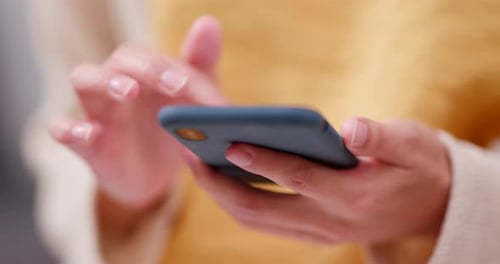 Hands Using a Smartphone in Close Up View