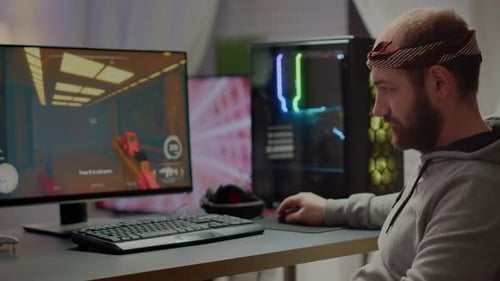 Man Playing Video Game on Computer