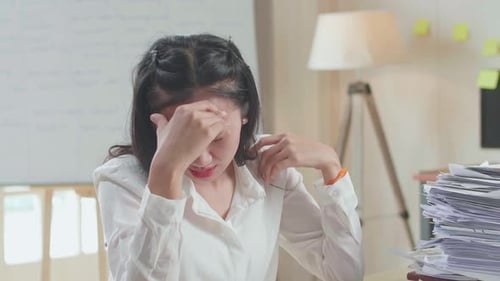 Close Up Of Pressure Asian Woman Throw Away The Paper While Working Hard With Documents