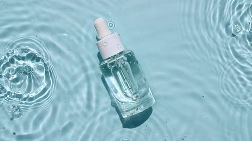 Clear Cosmetic Bottle in Rippling Water