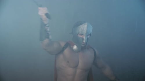 Ancient Warrior Holding Blade Under Rain.