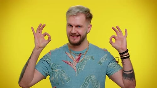 Smiling Young Adult Giving Okay Sign