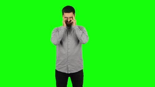 Brunette Guy Is Suffering From Headache From Fatigue. Green Screen