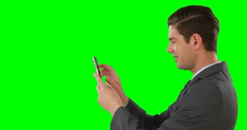Side view of businessman using mobile phone
