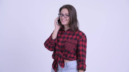 Happy Young Beautiful Hipster Woman Talking on the Phone