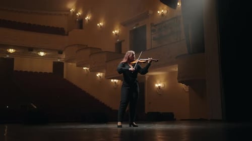 Female Violinist is Playing Violin in Music School or Dark Music Hall Fulllength Portrait of