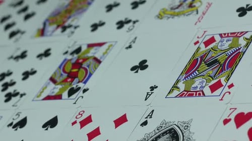 Playing Cards Arrayed on a Flat Surface